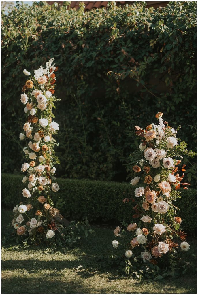 neutral florals ceremony arch