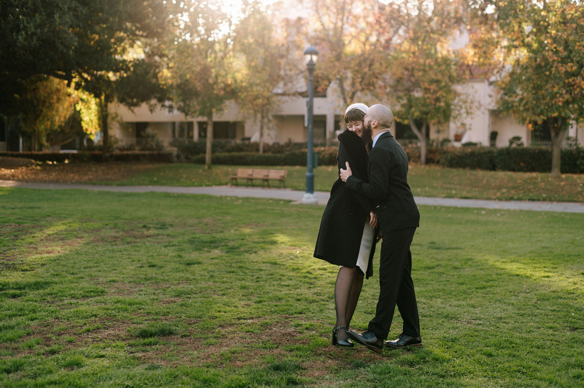 A couple embraces during their NYC inspired engagement session in San Diego.